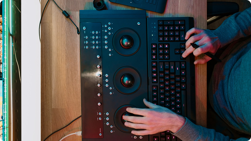 Cleanroom operator interacting with machine control panel